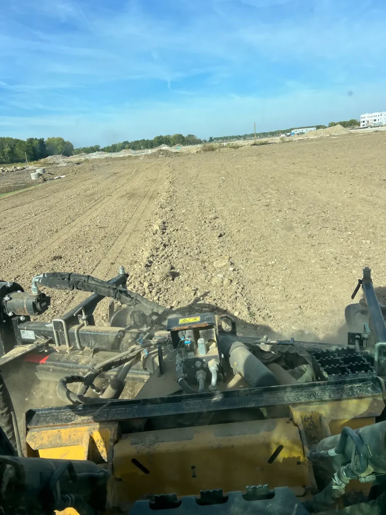 Finish grading a large lot ready for seed