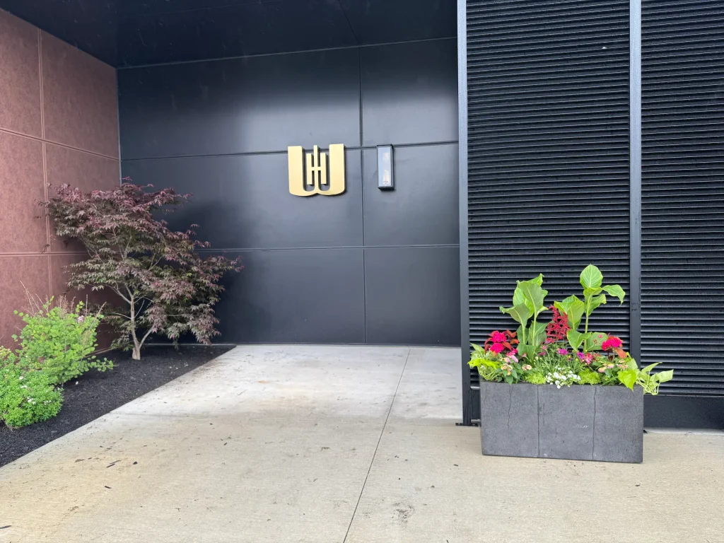 Seasonal planter at a modern commercial entrance